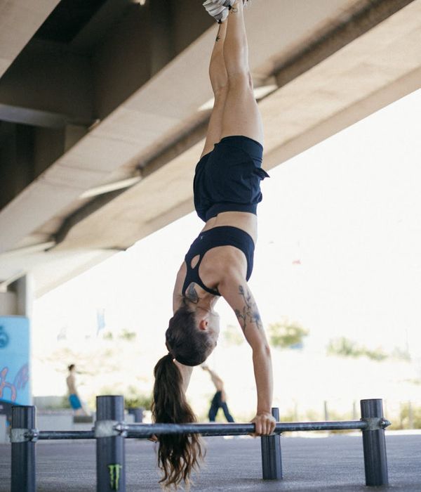 Person holding a strong yoga pose, showing balance and concentration.